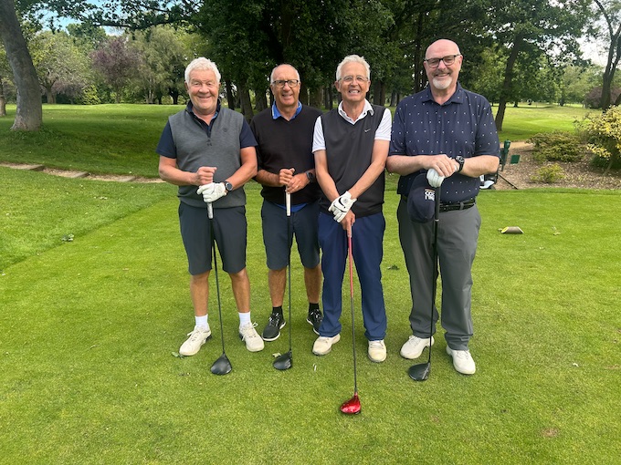 A four-ball lined up on the tee