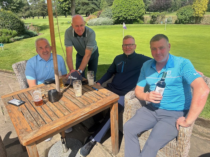 Members on the terrace beside the putting green