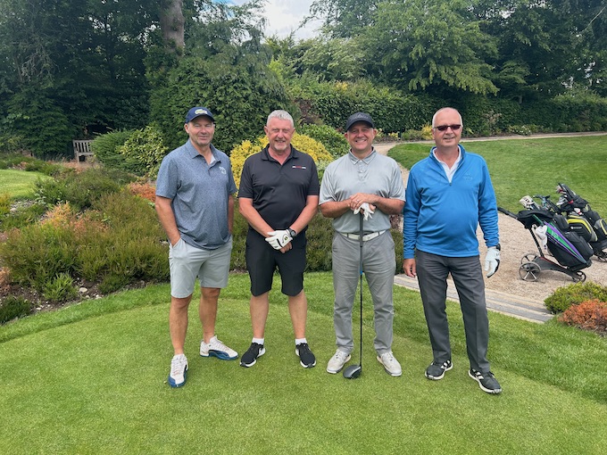A four-ball in front of the garden borders at Olton