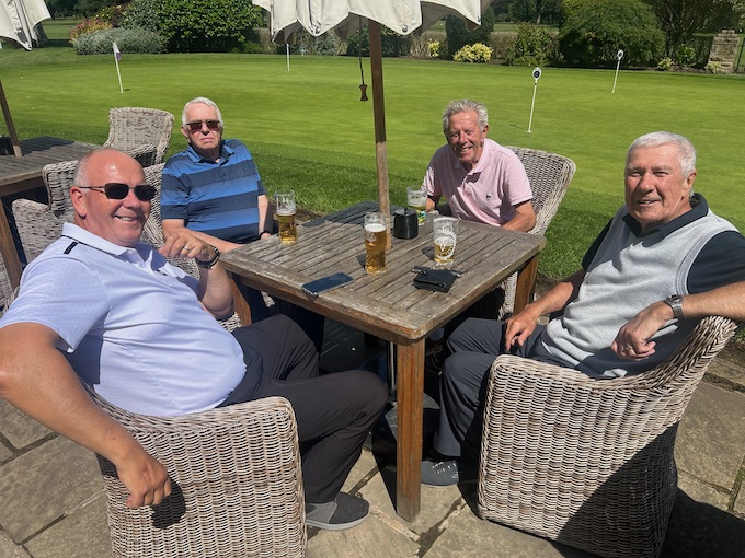 Members enjoying a drink in the sunshine