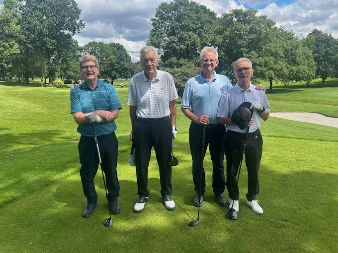 A four-ball on the tee under big skies